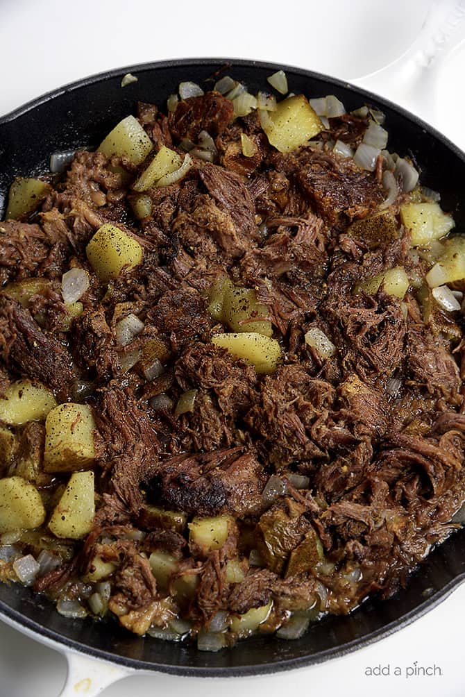 Southern Beef Hash Recipe - Southern Beef Hash is a great way to use leftover roast beef in a whole new way. Full of potatoes, onions, garlic, and roast beef, beef hash is a favorite. // addapinch.com