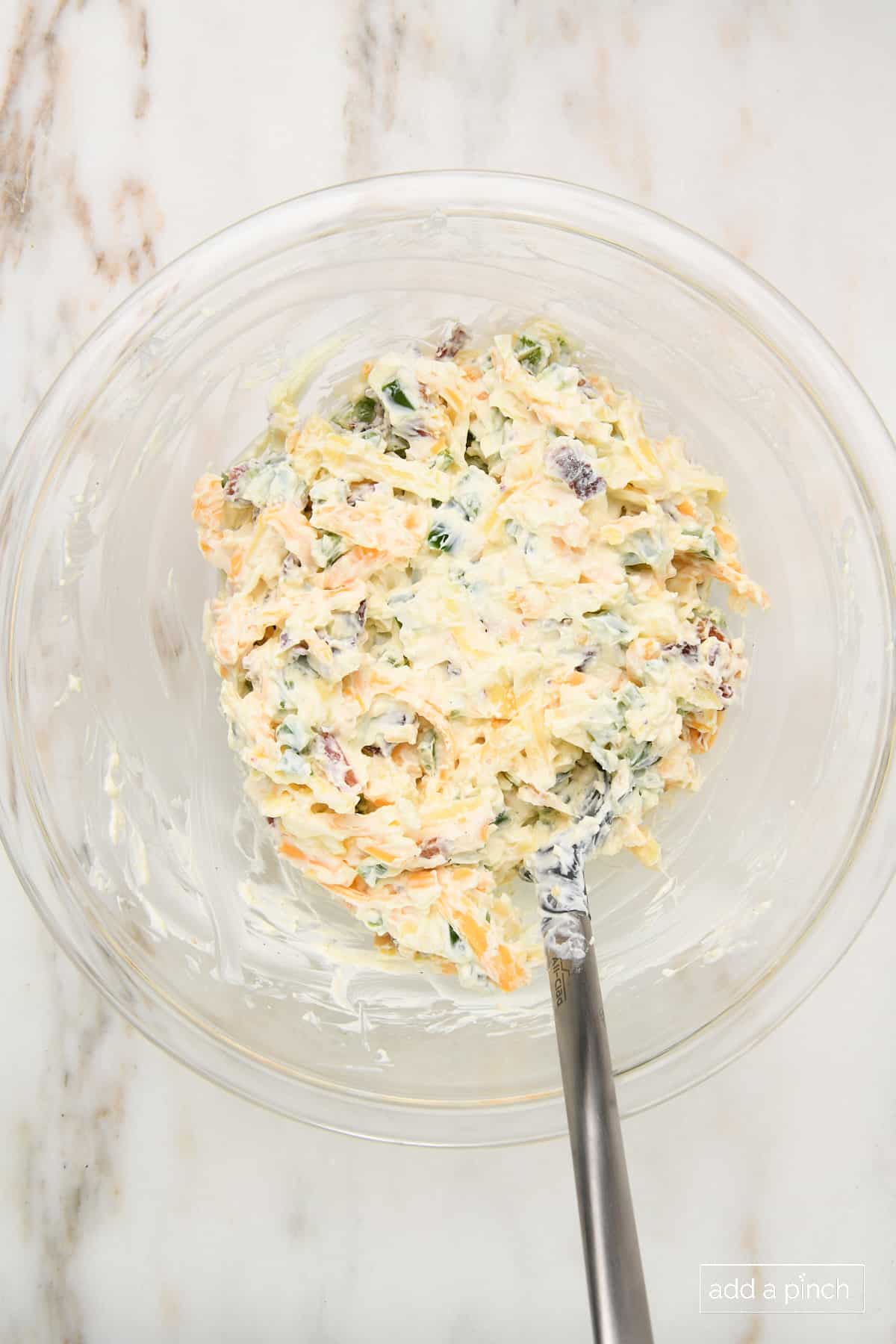 Combined jalapeno popper dip in a mixing bowl