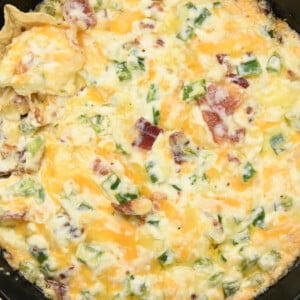 Jalapeno Popper Dip baked in a skillet with tortilla chips