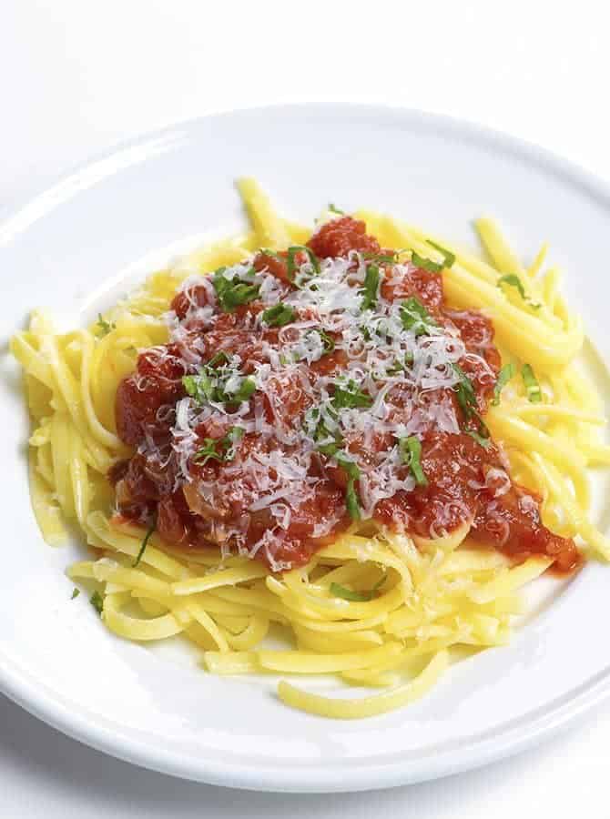 Homemade Marinara Sauce Recipe - This homemade marinara sauce recipe is made with classic, fresh ingredients, and is so simple to prepare! // addapinch.com
