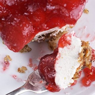 Strawberry Pretzel Salad Recipe - Strawberry Pretzel Salad makes a classic, nostalgic recipe. A creamy, fruity recipe made with strawberry gelatin, cream cheese, whipped topping, and pretzels. It is always a favorite. // addapinch.com