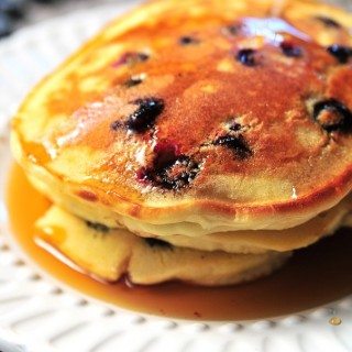 Lemon Blueberry Pancakes on a white platter.