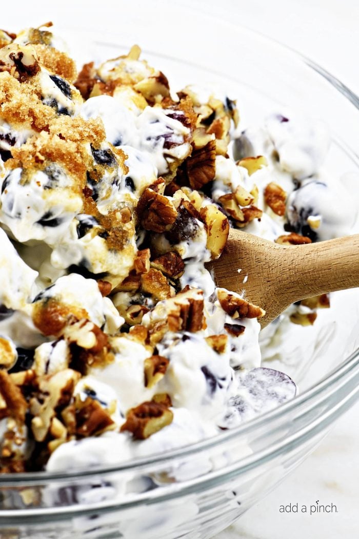 Grape Salad Recipe - Grape salad makes an easy and delicious side dish or dessert! Creamy, crunchy and made with just 5 ingredients! It is family favorite recipe! // addapinch.com