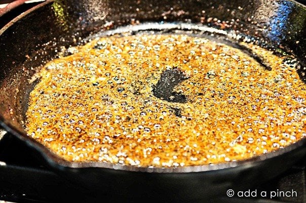 Making dressing with the bacon grease for potato salad.