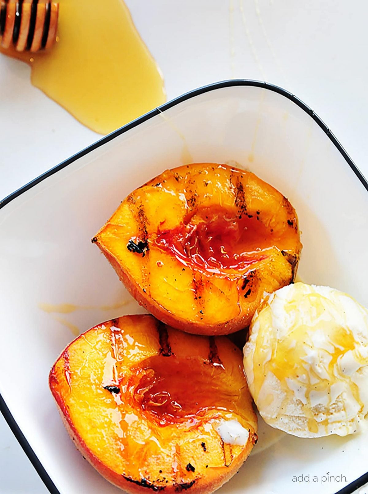 Grilled peaches with vanilla ice cream and honey is a perfect, simple and scrumptious summertime dessert.
