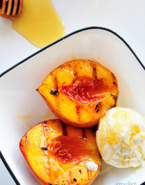 Grilled peaches with vanilla ice cream and honey is a perfect, simple and scrumptious summertime dessert. // addapinch.com