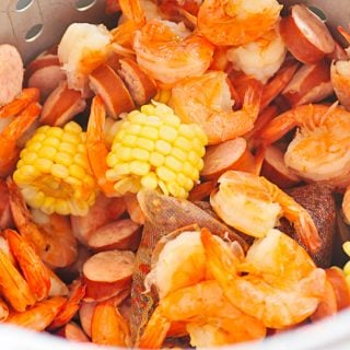 Shrimp Boil Recipe - This classic shrimp boil recipe is a family favorite! Made with fresh shrimp, potatoes, sausage and corn! // addapinch.com