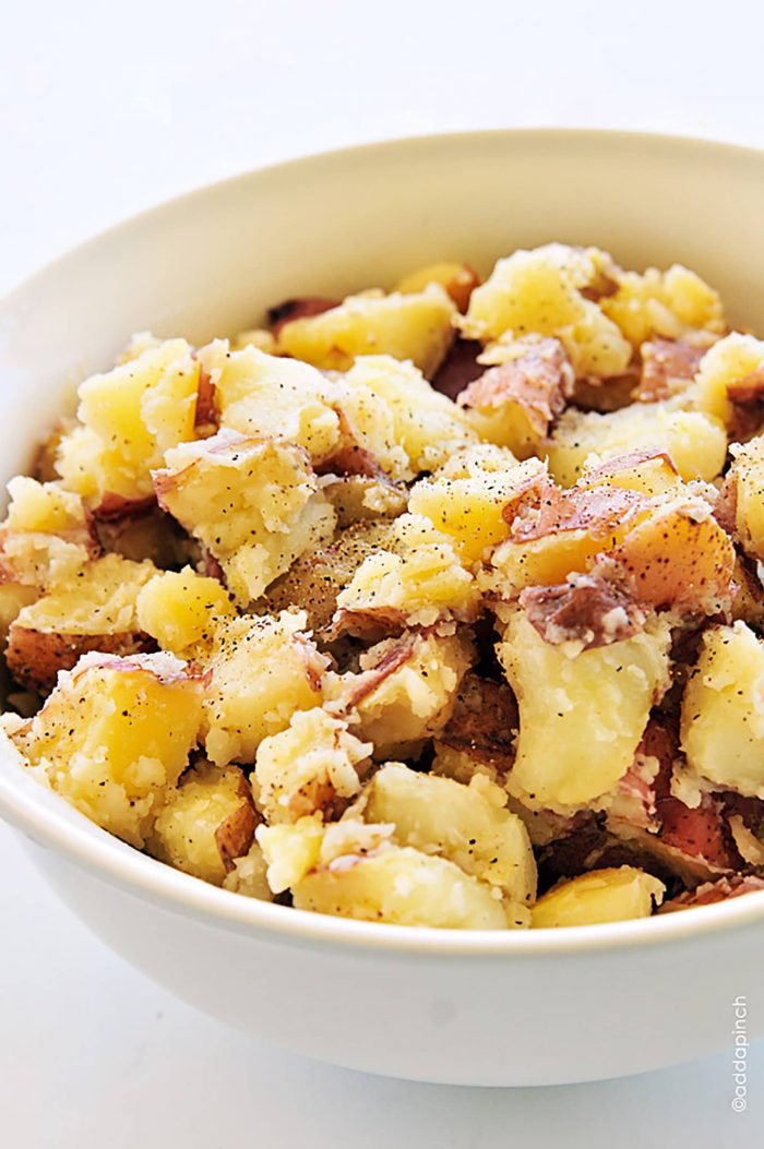 Buttered potatoes are a simple, classic, and comforting side dish recipe. // addapinch.com