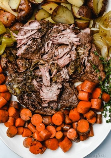 Classic Pot Roast is an easy comfort food that is an absolute favorite. A one pot meal made easy in the oven, slow cooker or Instant Pot! // addapinch.com