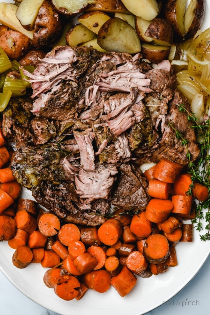 Classic Pot Roast is an easy comfort food that is an absolute favorite. A one pot meal made easy in the oven, slow cooker or Instant Pot! // addapinch.com