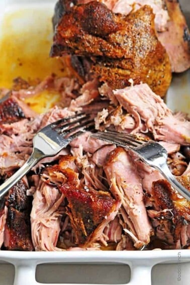 Perfect Pulled Pork Recipe - This simple slow cooker pork roast recipe makes the most amazing pulled pork! So easy! // addapinch.com