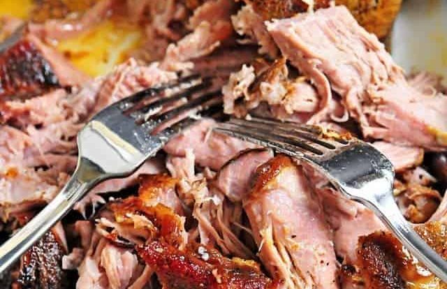 Perfect Pulled Pork Recipe - This simple slow cooker pork roast recipe makes the most amazing pulled pork! So easy! // addapinch.com