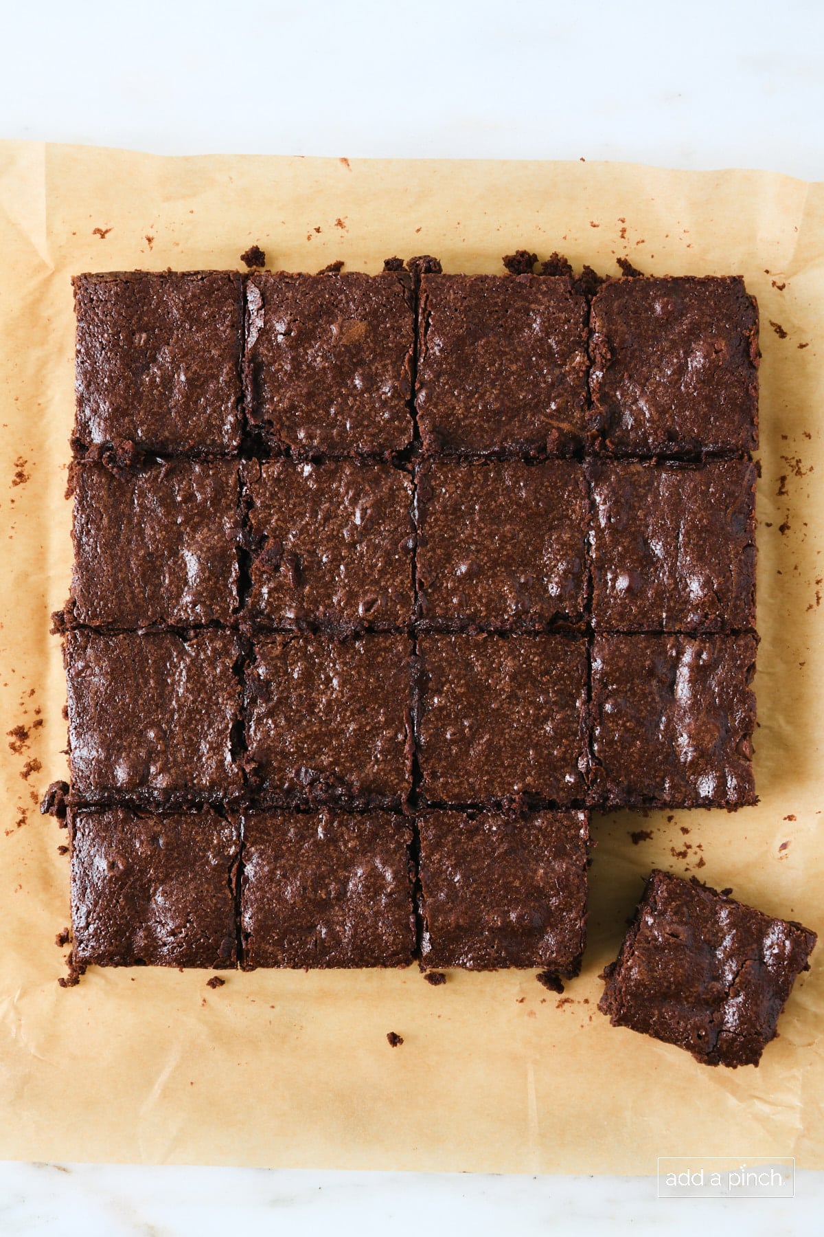 Cut brownies on a piece of parchment paper.