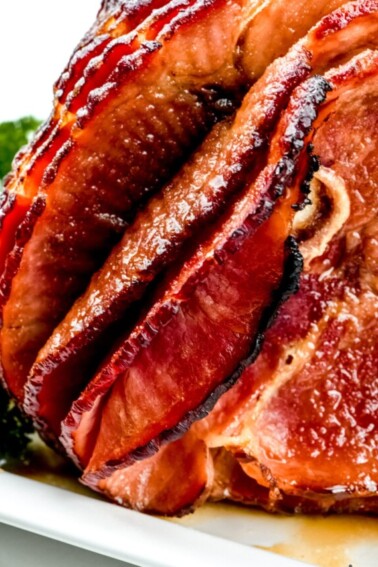 Cola Glazed Ham Recipe - This classic cola glazed ham recipe with brown sugar makes an easy baked ham perfect for any occasion!  // addapinch.com