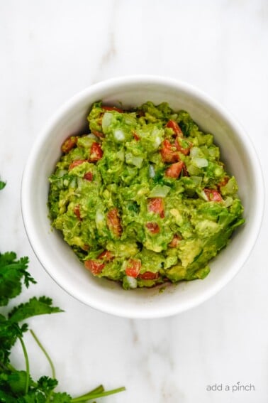 White bowl with guacamole.