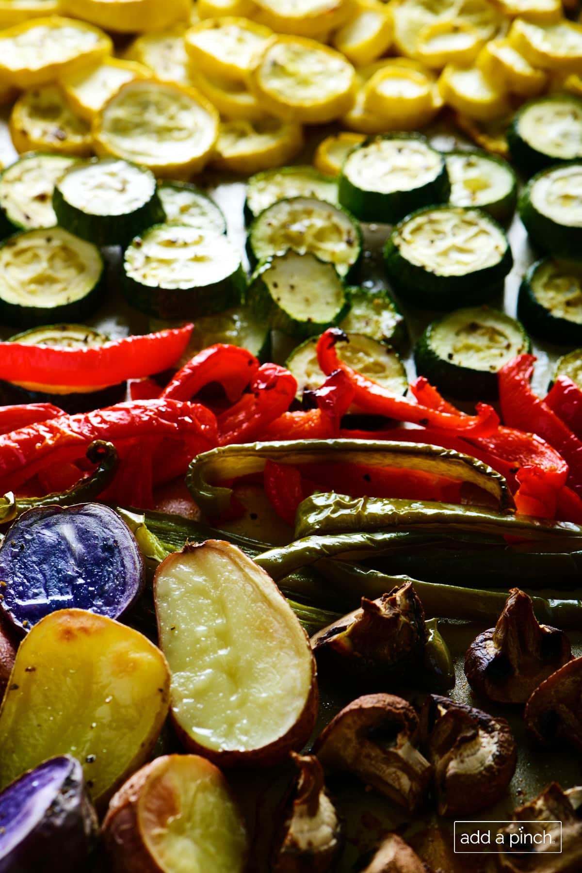 Oven roasted vegetables on a baking sheet.