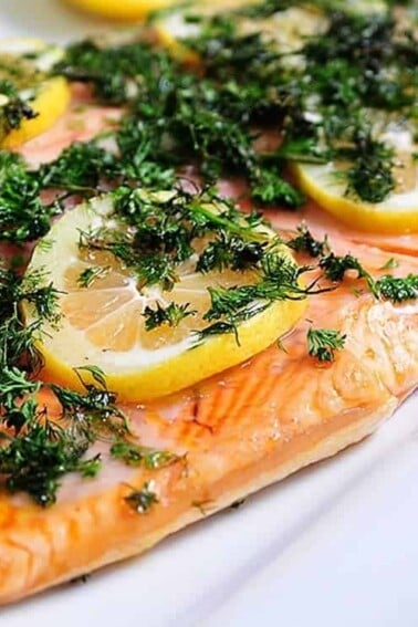 Lemon Dill Salmon Recipe - Ready in less than 30 minutes! Perfect for a light weeknight meal or easy entertaining! // addapinch.com