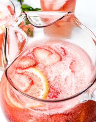 A delicious Strawberry Lemonade that's so easy and refreshing! Made from strawberries, lemons and simple syrup, it's perfect to enjoy all spring and summer! // addapinch.com