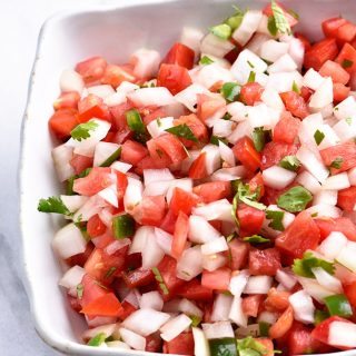 Pico de Gallo Recipe - Pico de Gallo has to be one of the simplest recipes to make and adds so, so, so much flavor to any number of dishes as a topping or just right by itself on a chip! // addapinch.com