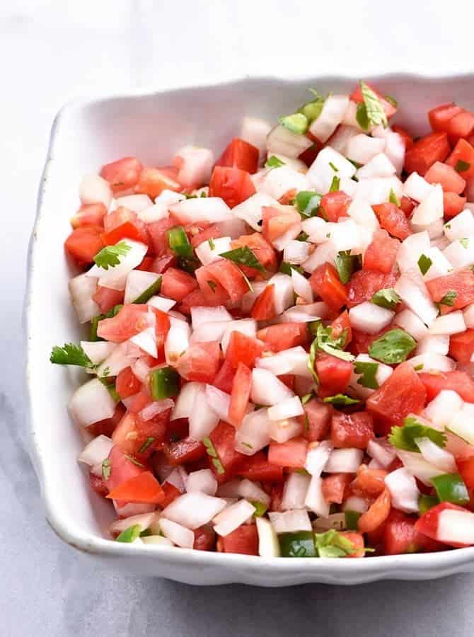 Pico de Gallo Recipe - Pico de Gallo has to be one of the simplest recipes to make and adds so, so, so much flavor to any number of dishes as a topping or just right by itself on a chip! // addapinch.com