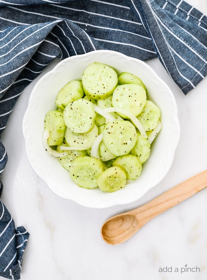 CucumberÂ Salad Recipe - This refreshing cucumber salad is a great side dish for any meal - chicken, beef, pork, fish, or vegetables! A longtime family favorite ready in minutes and full of flavor! // addapinch.com