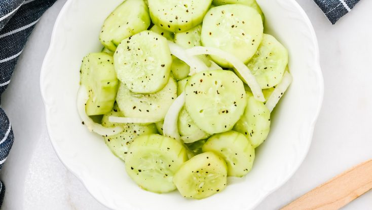 Cucumber Salad Recipe - This refreshing cucumber salad is a great side dish for any meal - chicken, beef, pork, fish, or vegetables! A longtime family favorite ready in minutes and full of flavor! // addapinch.com