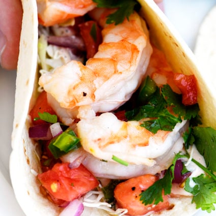 Shrimp Tacos Recipe - These quick and easy shrimp tacos are always a favorite. Made with delicious, tender grilled shrimp, pico de gallo in a soft taco. // addapinch.com