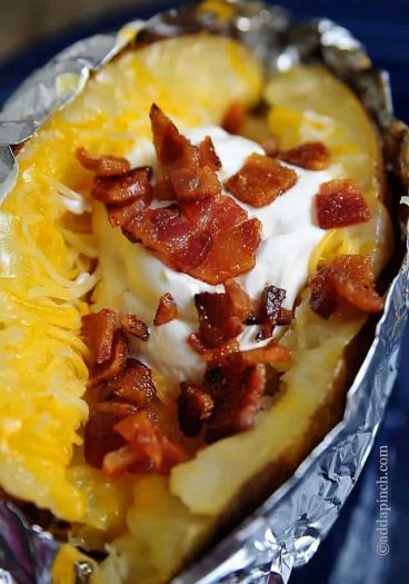 Slow Cooker Baked Potatoes Recipe - Baked Potatoes are an all-time favorite dish. Get this recipe for Slow Cooker Baked Potatoes for the perfect, restaurant quality baked potato! // addapinch.com