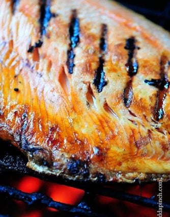 Grilled Salmon Recipe - Grilled Salmon is a favorite, light and delicious meal. This grilled salmon recipe is the perfect combination of savory and sweet and will quickly become a favorite. // addapinch.com