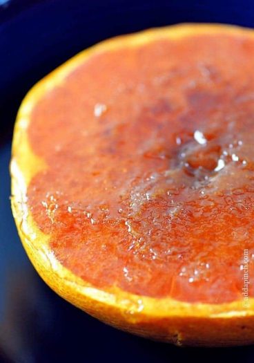 Broiled grapefruit makes one of those quick, easy, delicious, amazing breakfast or brunch recipes that is simply amazing. In about five minutes, you have this two ingredient broiled grapefruit that everyone loves! // addapinch.com