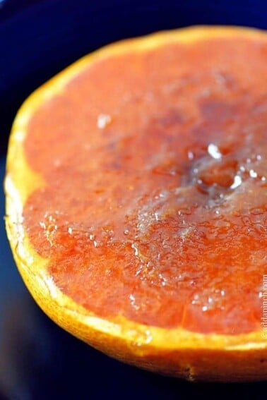 Broiled grapefruit makes one of those quick, easy, delicious, amazing breakfast or brunch recipes that is simply amazing. In about five minutes, you have this two ingredient broiled grapefruit that everyone loves! // addapinch.com
