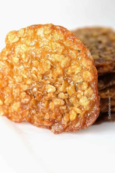Oatmeal Lace Cookies are thin, crisp, delicate and buttery cookies. This lace cookies recipe is a family favorite. // addapinch.com