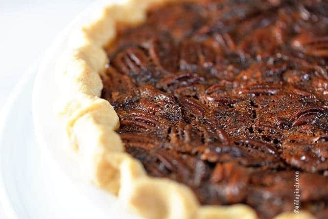 The BEST Pecan Pie Recipe - This Pecan Pie Recipe is a classic in my husband's family. For every family gathering, you better believe there will be pecan pie sitting front and center on the dessert table. Every. single. time. // addapinch.com