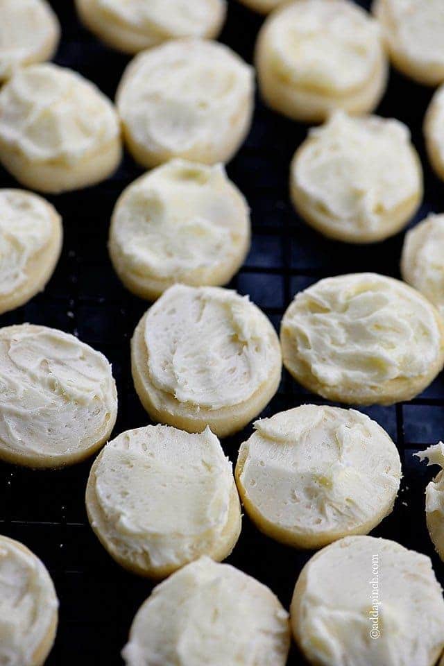 Little round cookies with dollops of key lime frosting on top.