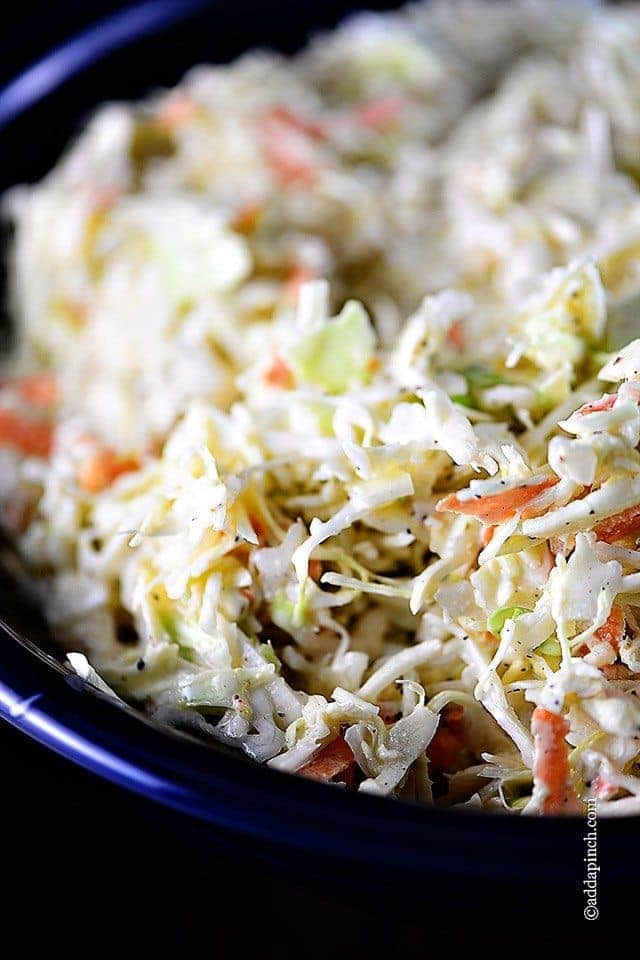 Coleslaw in a blue serving bowl // addapinch.com