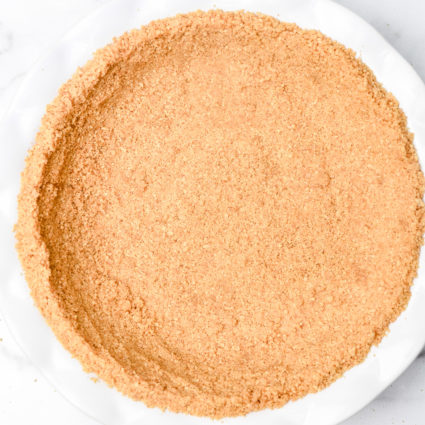 A simple graham cracker crust is perfect for so many recipes. From key lime pie to a chocolate tart, a graham cracker crust is a never fail favorite. // addapinch.com