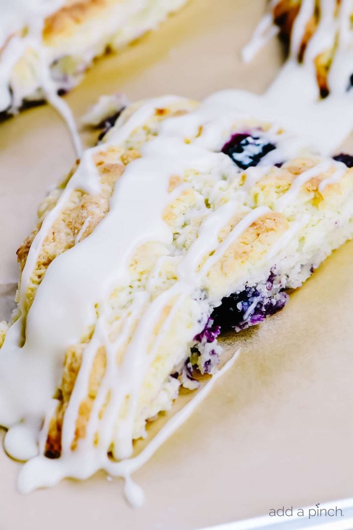 Lemon Blueberry Scones Recipe - Scones make a delicious treat for breakfast, brunch or an afternoon treat. These lemon blueberry scones are full of flavor while being light and moist. // addapinch.com