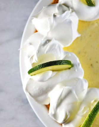 Key Lime Pie Recipe - Key Lime Pie makes a classic, refreshing dessert recipe. Made of simple ingredients, this updated key lime pie recipe comes together quickly and chills to a light and airy consistency for an elegant dessert. // addapinch.com