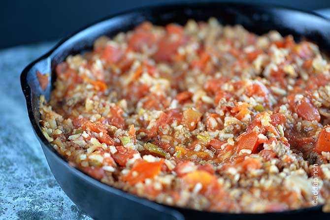 Spanish Rice Recipe - This Spanish Rice recipe is made with ground beef for a main dish meal! Ready in less than 30 minutes! // addapinch.com