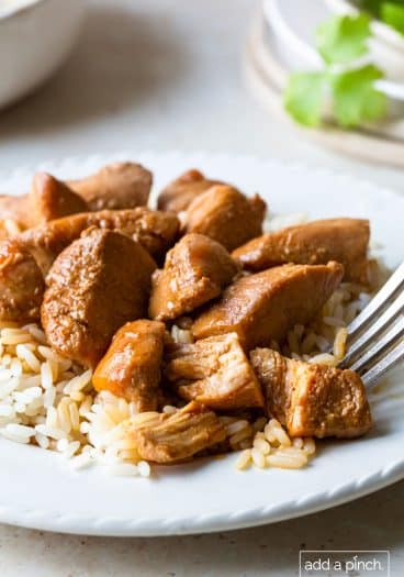 Photo of chicken teriyaki on a white plate.