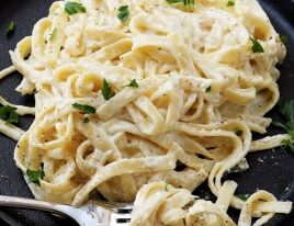 Alfredo Sauce Recipe - Made of cream, butter, and garlic, this quick and easy alfredo sauce recipe comes together quickly for a comforting homemade classic! // addapinch.com