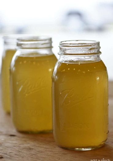 Homemade Chicken Stock Recipe - Learn how to make homemade chicken stock in just a few easy steps! // addapinch.com