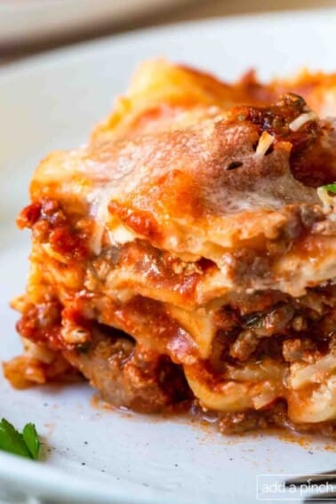 Image of lasagna on a white plate.