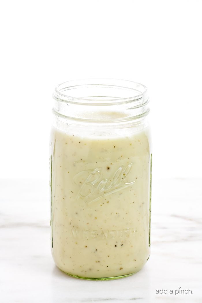 Condensed Cream of Chicken Soup - clear glass jar filled with  homemade condensed cream of chicken soup. // addapinch.com