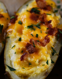 Twice Baked Potatoes Recipe - These potatoes make any meal an event! They take baked potatoes to a whole new level of creamy, cheesy, buttery deliciousness. Easy enough to make ahead in stages, twice baked potatoes make an elegant side dish when entertaining! // addapinch.com