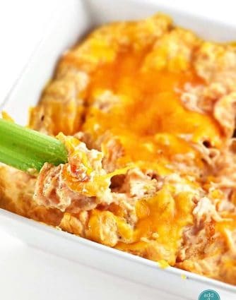 Buffalo Chicken Dip tastes just like the buffalo chicken we all love. This creamy buffalo chicken dip comes together easily and is always a winner! // addapinch.com