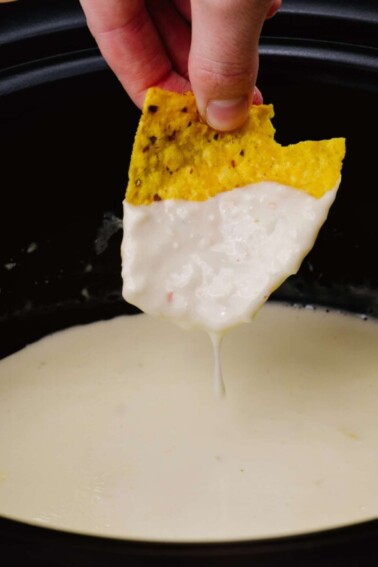 This Queso Recipe has only 4 ingredients but can be made 3 ways! Make this easy queso on the stovetop, slow cooker or microwave for the perfect appetizer! It’s a delicious recipe you’ll make time and again! // addapinch.com