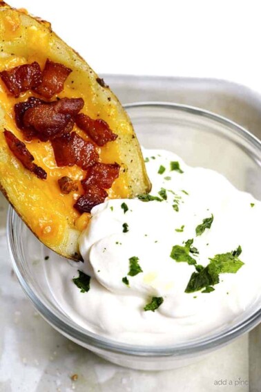 Homemade Potato Skins Recipe - Potato skins make an easy and delicious recipe perfect for parties or game day! // addapinch.com