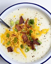 Loaded Baked Potato Soup Recipe - Loaded baked potato soup makes a warm, comforting potato soup recipe. Made with baked potatoes blended into a creamy soup and topped with your potato bar favorites! // addapinch.com
