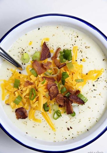 Loaded Baked Potato Soup Recipe - Loaded baked potato soup makes a warm, comforting potato soup recipe. Made with baked potatoes blended into a creamy soup and topped with your potato bar favorites! // addapinch.com